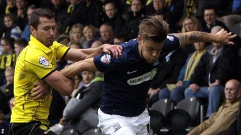 Burton's Phil Edwards holding on to Southend United's Kevan Hurst
