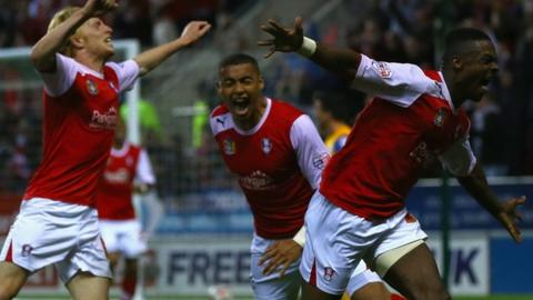 Rotherham players celebrate Kieran Agard's goal