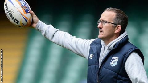 Paul John holds up a ball during a Blues training session