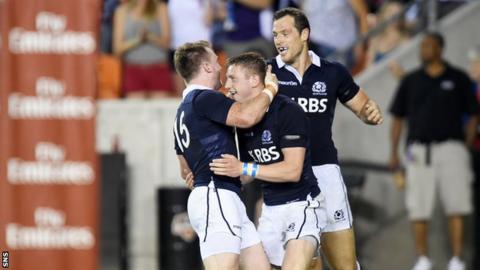 Scotland's Stuart Hogg (left) celebrates his try with team-mates Finn Russell (centre) and Tim Visser