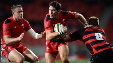 James Hook of Wales is tackled by Paul Schoemnan