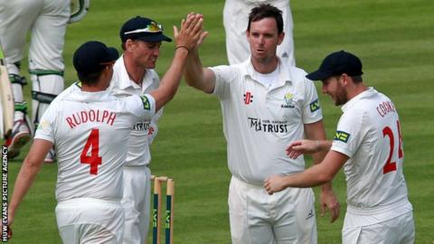 Glamorgan’s Jim Allenby celebrates after bowling out Rob Key