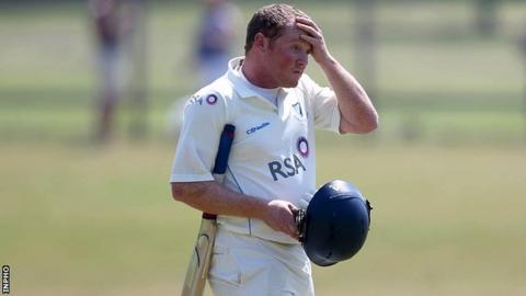 Andrew Poynter leaves the pitch dejected after being bowled