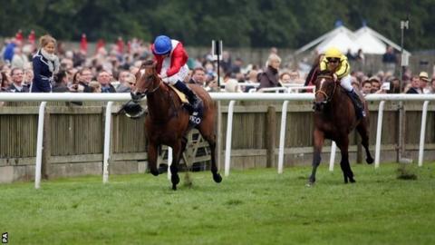 Integral, ridden by Ryan Moore, wins the Qipco Falmouth Stakes