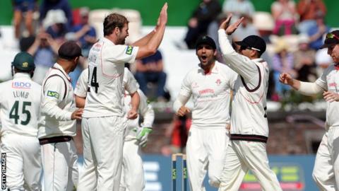 Tom Smith celebrates a wicket