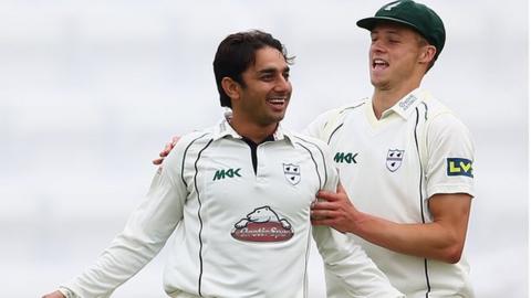 Saeed Ajmal (left)