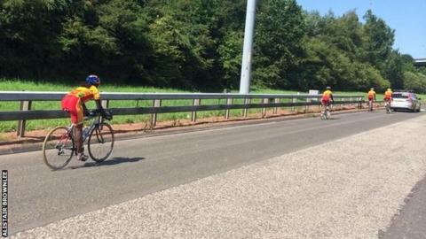 The Sri Lankan team cyclists photographed on the M74 by Team England triathlete Alistair Brownlee