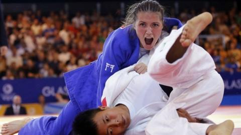 Scotland's Kimberley Renicks in action against India's Sushila Likmabam