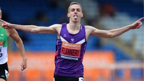 Niall Flannery celebrates as he crosses the line to become 2014 British 400m hurdles Champion