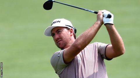 Graeme McDowell watches his second shot at the sixth hole in the second round