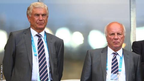 Director of Football Development in England Sir Trevor Brooking (L) and Chairman of the FA Greg Dyke look on during the 2014 FIFA World Cup Brazil Group D match between Costa Rica and England at Estadio Mineirao on June 24, 2014.