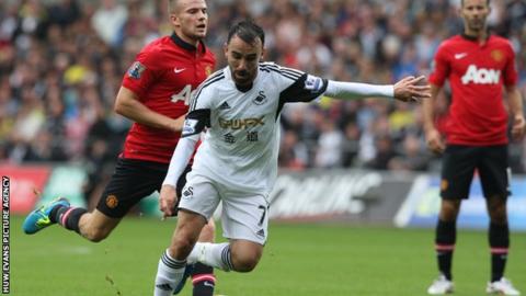 Leon Britton in action against Manchester United