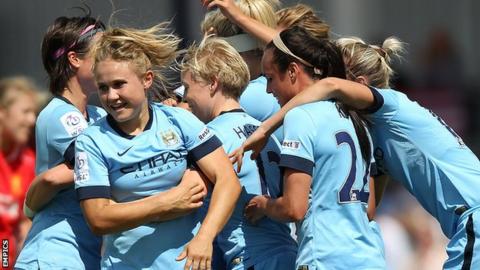 Manchester City Women's celebrate their goal against Liverpool