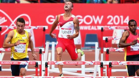 England's Andy Turner crashes out of the men's 110m hurdles