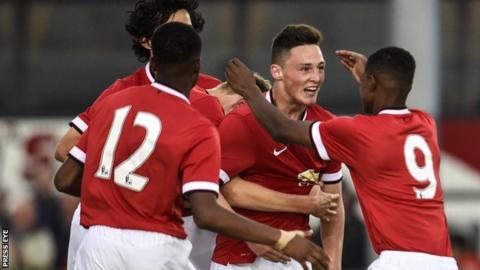 Jordan Andrew Thompson is congratulated by Man Utd team-mates