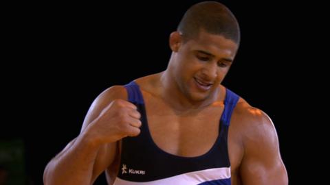 English wrestler Leon Rattigan celebrates winning bronze at the 2014 Commonwealth Games in Glasgow