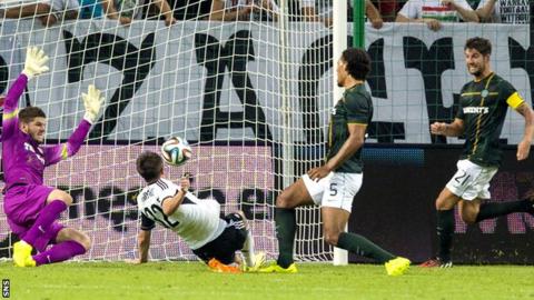 Legia Warsaw's Miroslav Radovic scores against Celtic