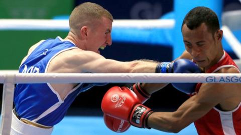 Paddy Barnes in action against Charles Keama in the men's light-flyweight quarter-final at the 2014 Commonwealth Games in Glasgow