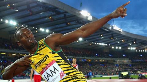 Usain Bolt celebrates a Jamaica win in the men's 4x100m relay at the 2014 Commonwealth Games