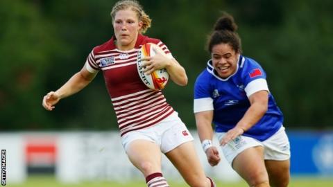 England's Lydia Thompson (l) in action against Samoa