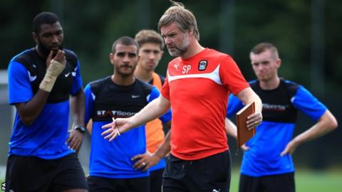Coventry City manager Steven Pressley coaches the players