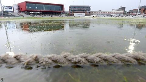 Rain on the outfield at Old Trafford