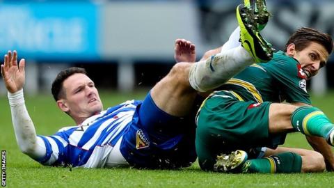 Sean Morrison goes in for a tackle
