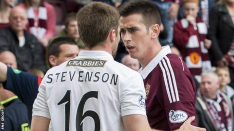 Lewis Stevenson and Jamie Walker clash at Tynecastle
