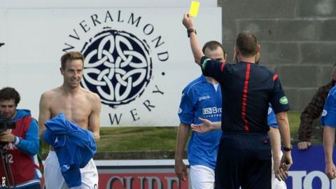 St Johnstone scorer Steven MacLean receives a yellow card for taking off his shirt as he celebrates his goal against Aberdeen