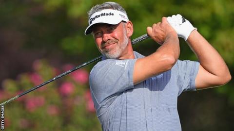 Darren Clarke hits a tee shot in Turin