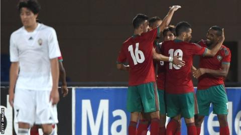 Morocco celebrate a goal against Qatar