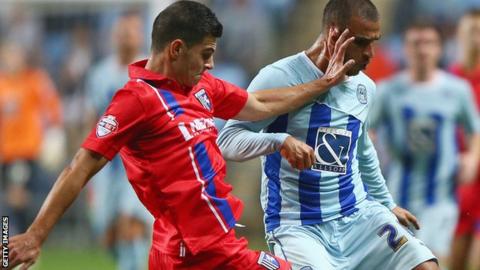 Gillingham's John Egan (left) and Coventry's Marcus Tudgay