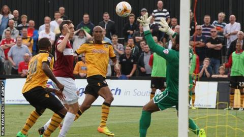 Chris Zebroski scores Newport's opening goal against Northampton