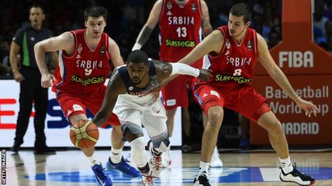 USA's Kyrie Irving protects the ball