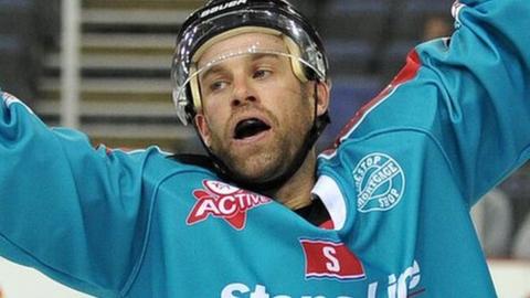 Evan Cheverie of the Belfast Giants celebrates scoring the third goal against the Edinburgh Capitals