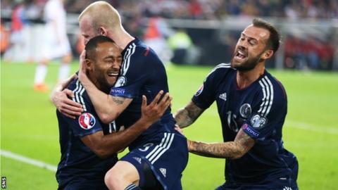 Ikechi Anya celebrates his goal with Steven Naismith and Steven Fletcher