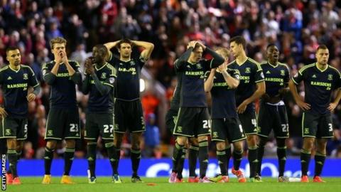 Middlesbrough players after their defeat at Liverpool