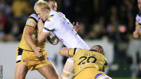 Warrington's Rhys Evans tackled by Castleford players