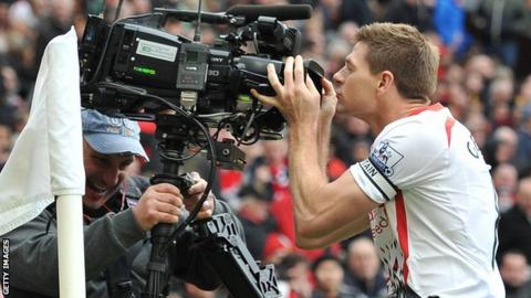 Liverpool captain Steven Gerrard kisses a TV camera during a Premier League match