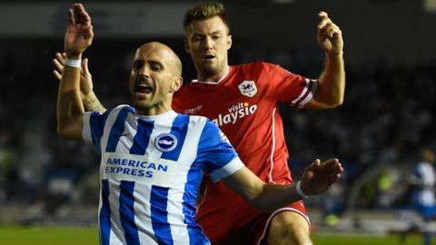 Bruno Salter of Brighton is fouled by Anthony Pilkington of Cardiff