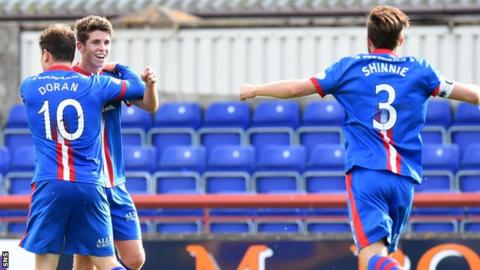 Ryan Christie (centre) celebrates with Aaron Doran and Graeme Shinnie