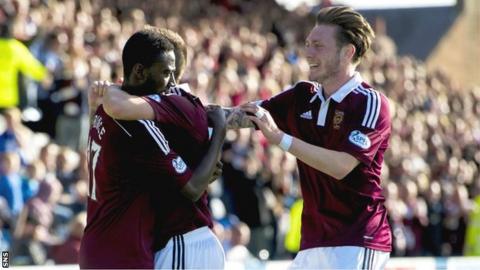 The Hearts players congratulate Prince Buaben on scoring the team's second