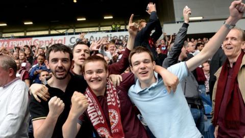 Football fans applauding