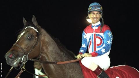 Gerry Bailey of the USA on Cigar celebrates winning the Dubai World Cup in 1996