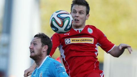 Gary Twigg and Jaimie McGovern in action