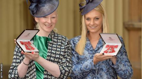 Kelly Gallagher and guide Charlotte Evans with their MBEs at Buckingham Palace