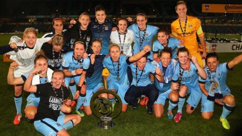 Manchester City players celebrate after winning the 2014 Continental Cup