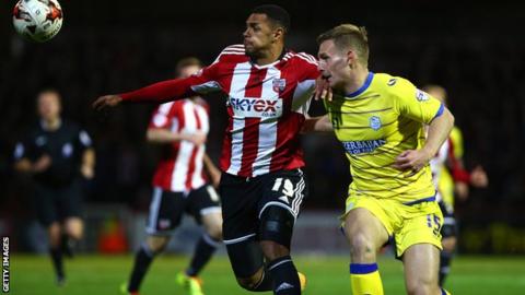 Andre Gray of Brentford holds off Sheffield Wednesdays Tom Lees