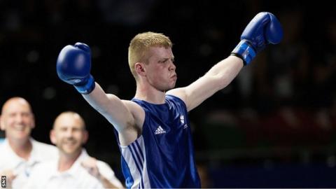 Charlie Flynn celebrates after beating Joe Cordina in the Commonwealth Games
