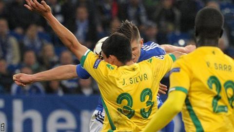Jonathan Silva (number 33) blocks the ball